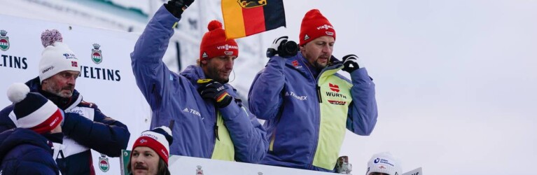 Die deutschen Trainer Heinz Kuttin und Kai Bracht blicken gespannt auf ihre Athleten.