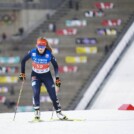 Magdalena Burger (GER) läuft vor den Olympischen Ringen.