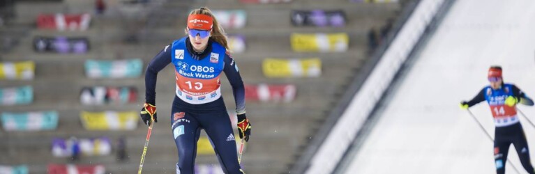 Magdalena Burger (GER) läuft vor den Olympischen Ringen.